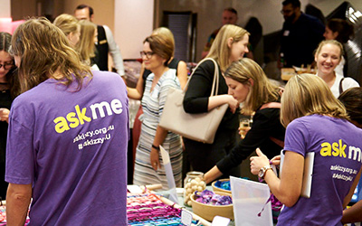 Infoxchange staff wearing "ask me" t-shirts