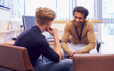 Young man talking to counsellor